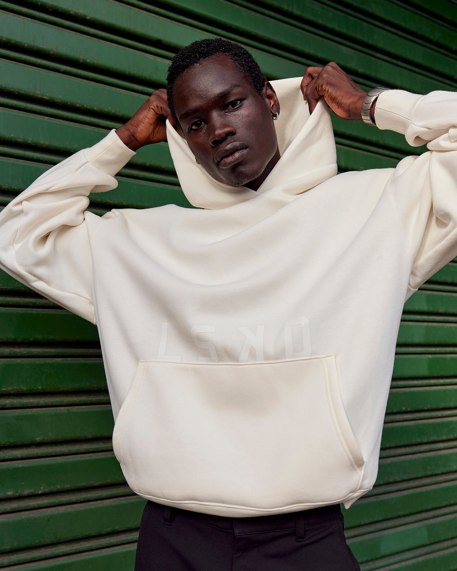 Man wearing Shadow Mode Oversized Hoodie - Off White | Model:Mabyro | Size:M