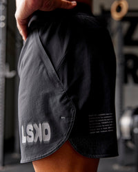 Man wearing Static Grit Lift 6" Short - Black-Alloy | Model:Jaiden | Size:M