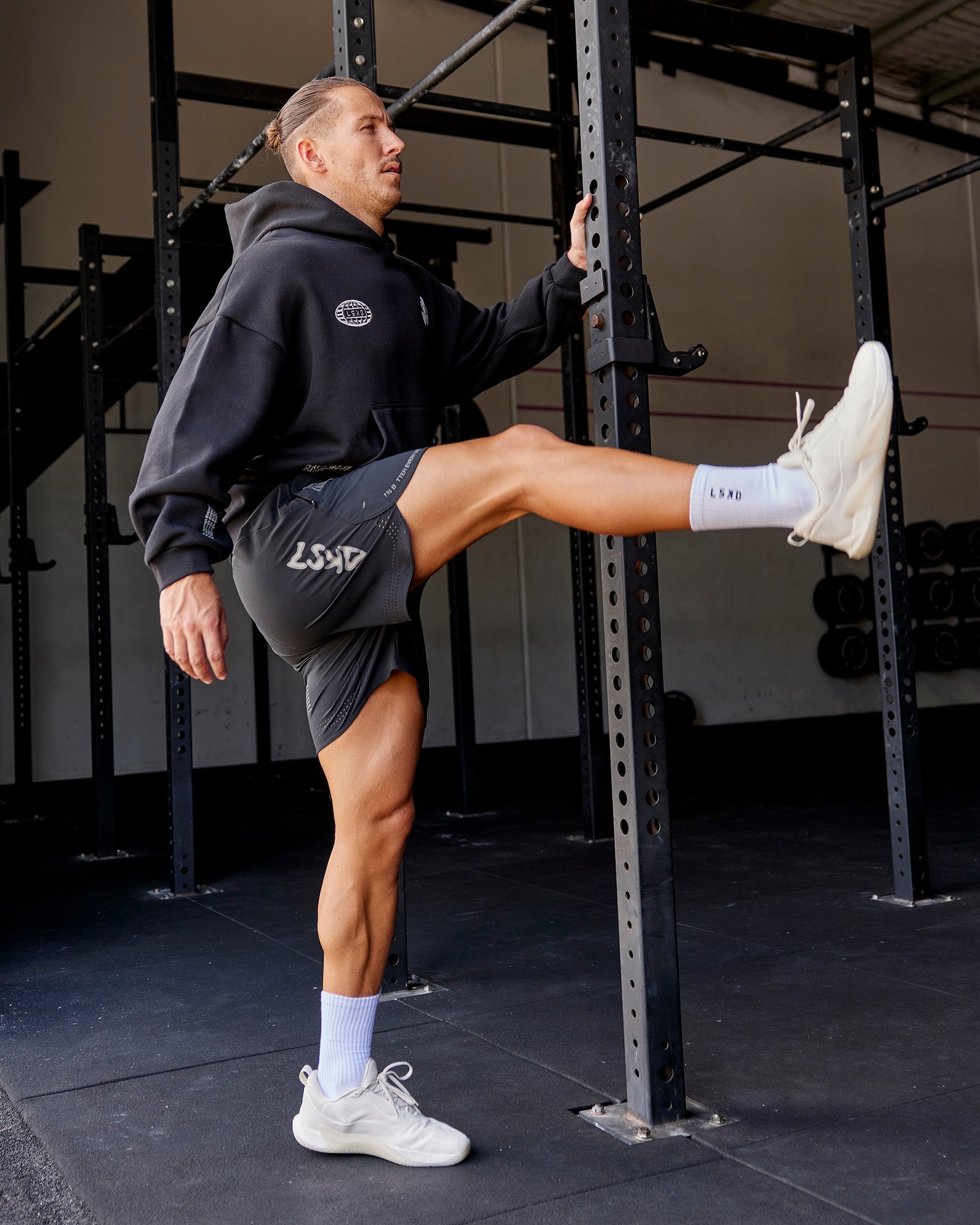 Man wearing Static Grit Lift 6" Short - Black-Alloy | Model:Jaiden | Size:M