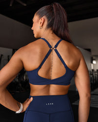 Woman wearing Twist Sports Bra D/DD/E - Future Navy | Model:Chyna | Size:M