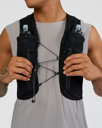 Woman wearing Pace Running Vest - Black-Reflective | Model:Daarian | Size:M/L