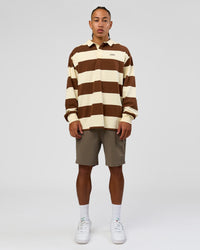 Man wearing Clubhouse Unisex Polo - Off White-Brown | Model:Malebo | Size:M