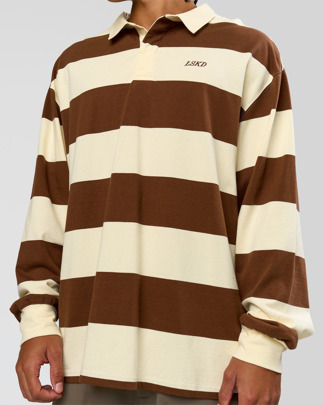 Man wearing Clubhouse Unisex Polo - Off White-Brown | Model:Malebo | Size:M