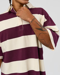 Man wearing Oversized Rugby Polo - Off White-Cherry | Model:Malebo | Size:M
