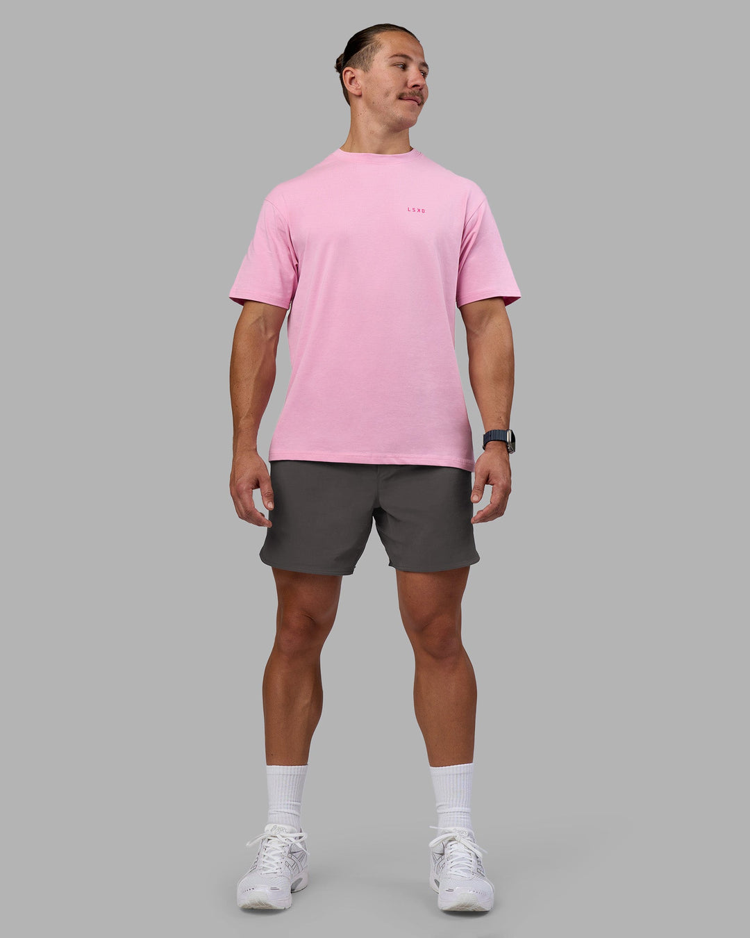 Man wearing 1% Better Value Series FLXCotton Tee Oversize - Bubblegum-Ultra Pink | Model:Jaiden | Size:M