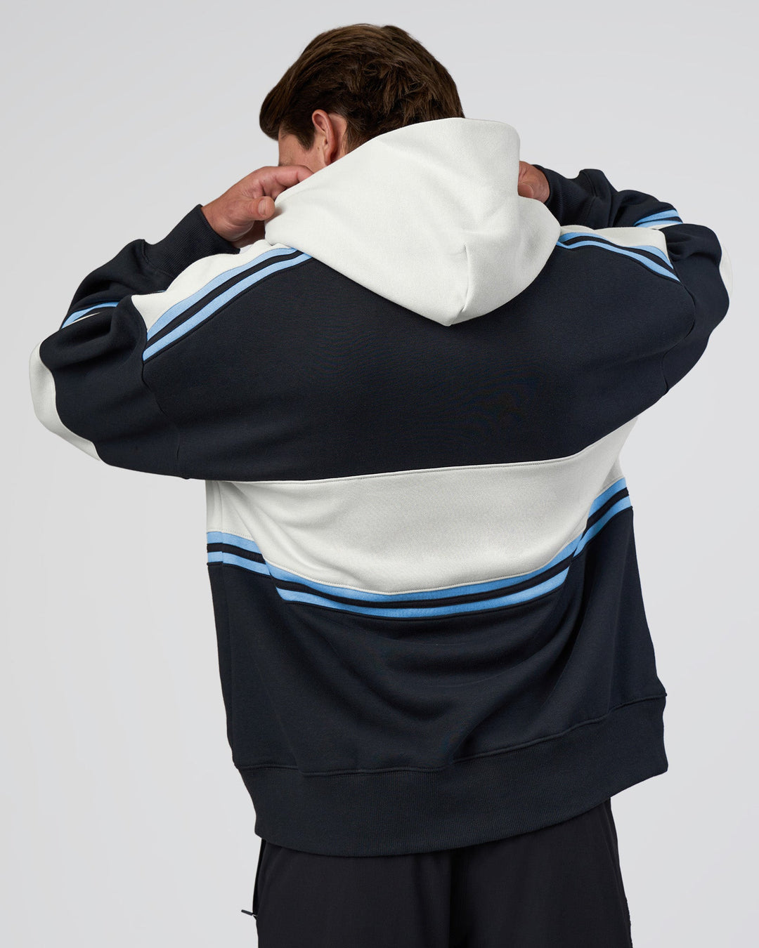 Man wearing A-Team Oversized Hoodie - Caviar-Open Air | Model:Konnor | Size:M