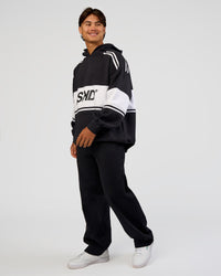 Man wearing A-Team Oversized Hoodie - Caviar-White | Model:George | Size:M