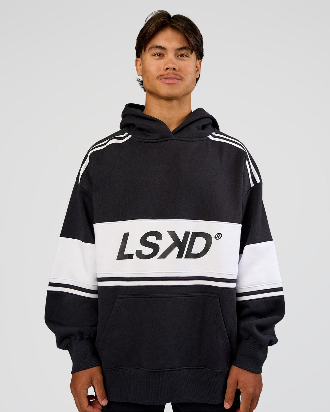 Man wearing A-Team Oversized Hoodie - Caviar-White | Model:George | Size:M