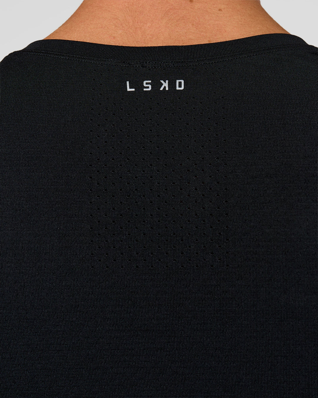 Man wearing AeroFLX+ Seamless Long Sleeve Tee (Set in Sleeve) in Black/Black | Model:Albert | Size:M - view 4