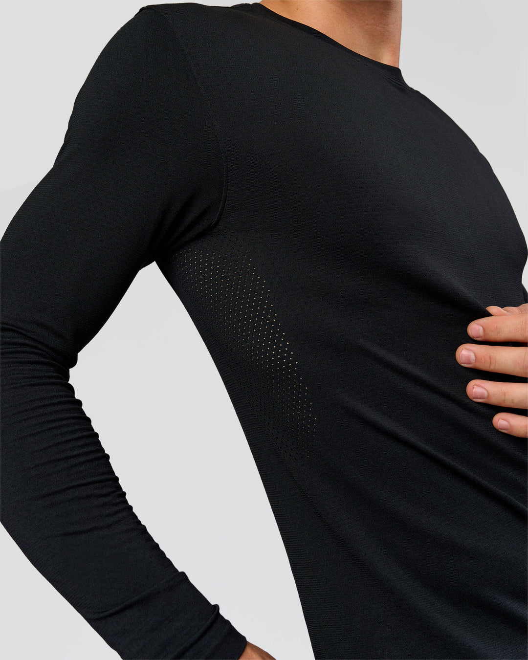 Man wearing AeroFLX+ Seamless Long Sleeve Tee (Set in Sleeve) in Black/Black | Model:Albert | Size:M - view 10