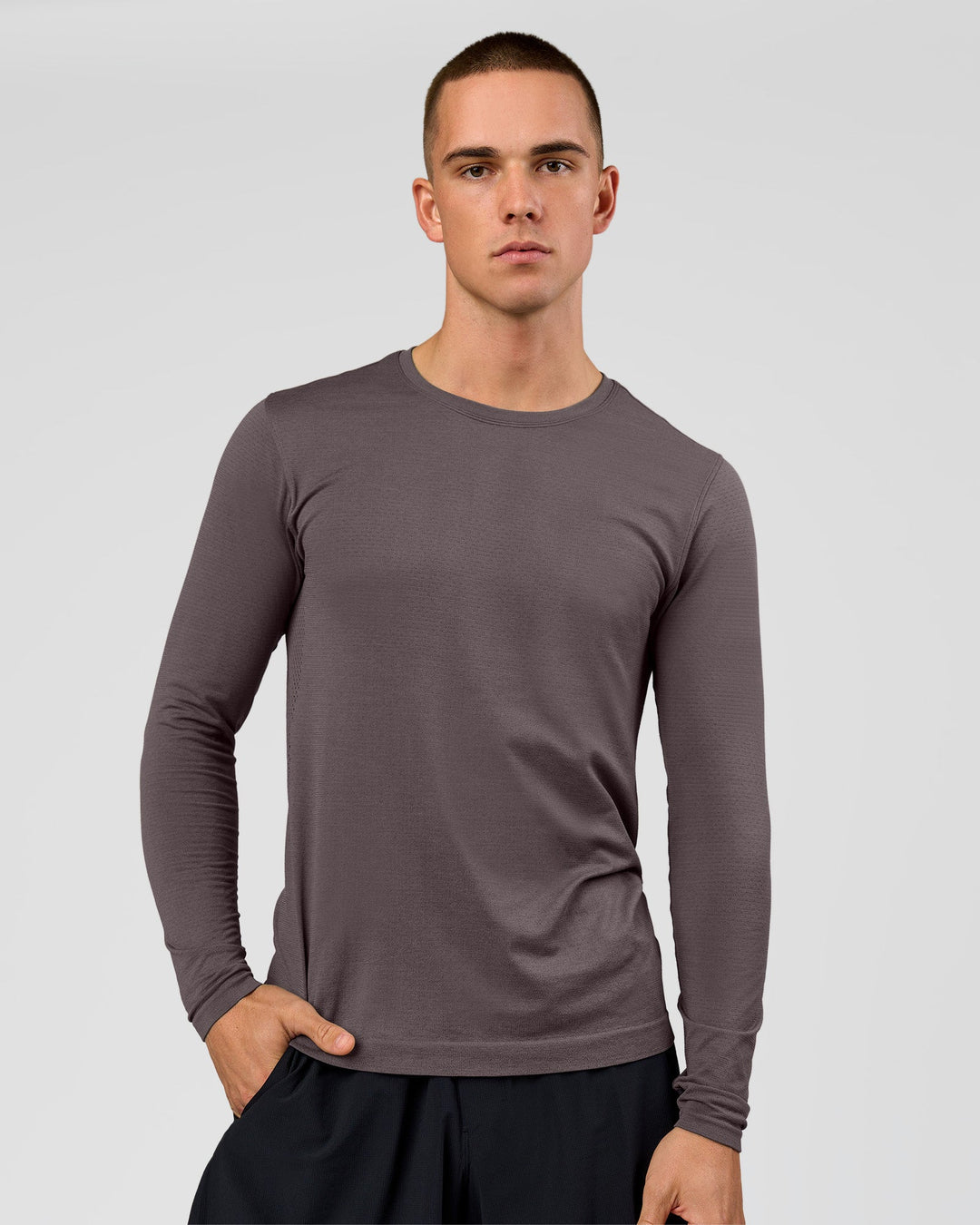Man wearing AeroFLX+ Seamless Long Sleeve Tee (Set in Sleeve) in Duskstone/Duskstone | Model:Albert | Size:M - view 1