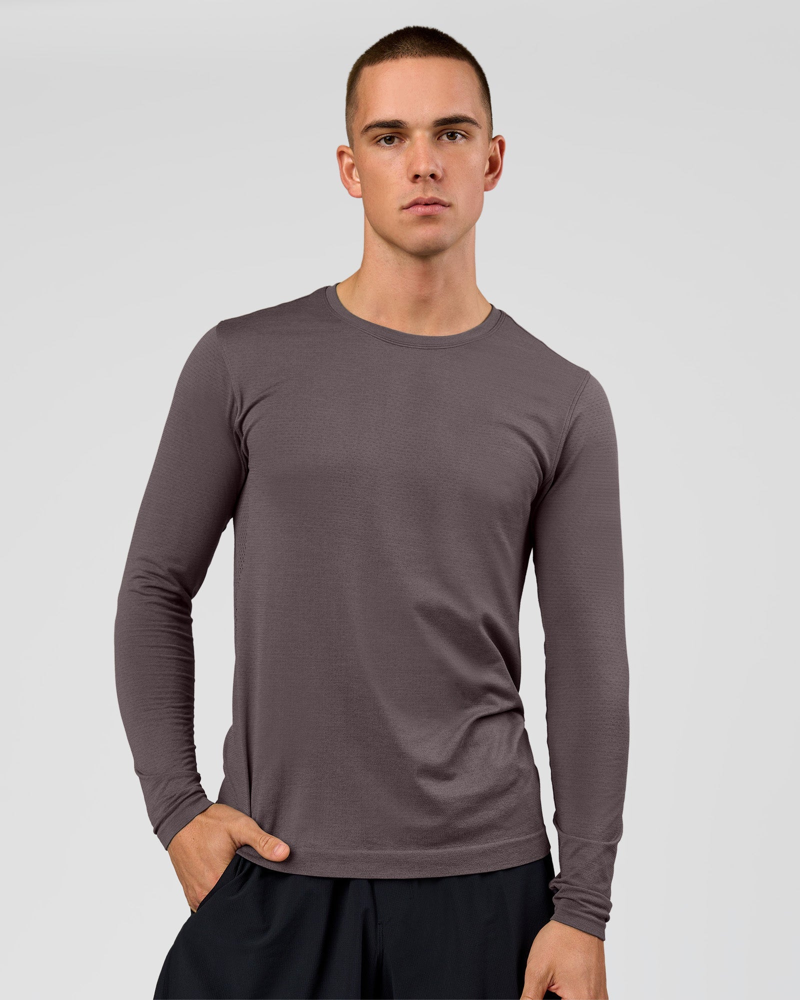Man wearing AeroFLX+ Seamless Long Sleeve Tee (Set in Sleeve) in Duskstone/Duskstone | Model:Albert | Size:M
