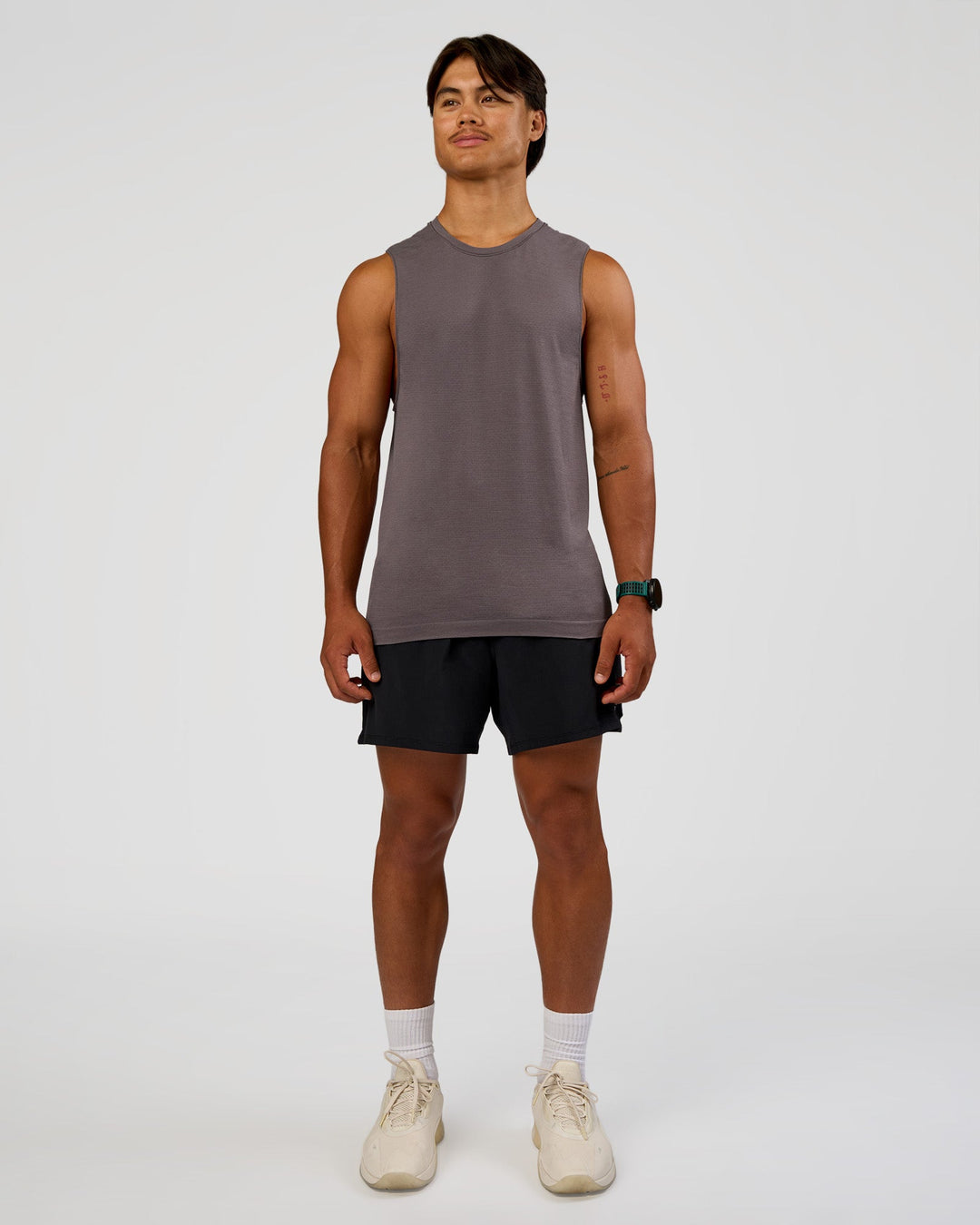 Man wearing AeroFLX+ Seamless Muscle Tank - Duskstone/Duskstone | Model:George | Size:M
