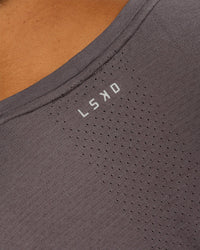 Man wearing AeroFLX+ Seamless Muscle Tank - Duskstone/Duskstone | Model:George | Size:M