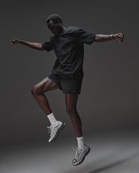 Man wearing AfterDark ZeroCrease Oversized Tee - Black | Model:Mabyro | Size:M