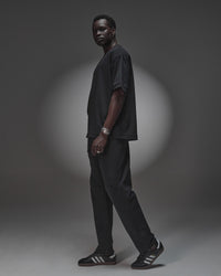 Man wearing AfterDark ZeroCrease Oversized Tee - Black | Model:Mabyro | Size:M
