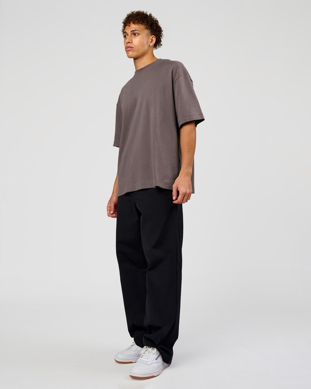 Man wearing AfterDark ZeroCrease Oversized Tee - Duskstone | Model:Leandro | Size:M