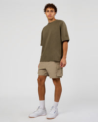 Man wearing AfterDark ZeroCrease Oversized Tee - Walnut Grey | Model:Leandro | Size:M