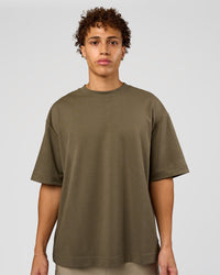 Man wearing AfterDark ZeroCrease Oversized Tee - Walnut Grey | Model:Leandro | Size:M