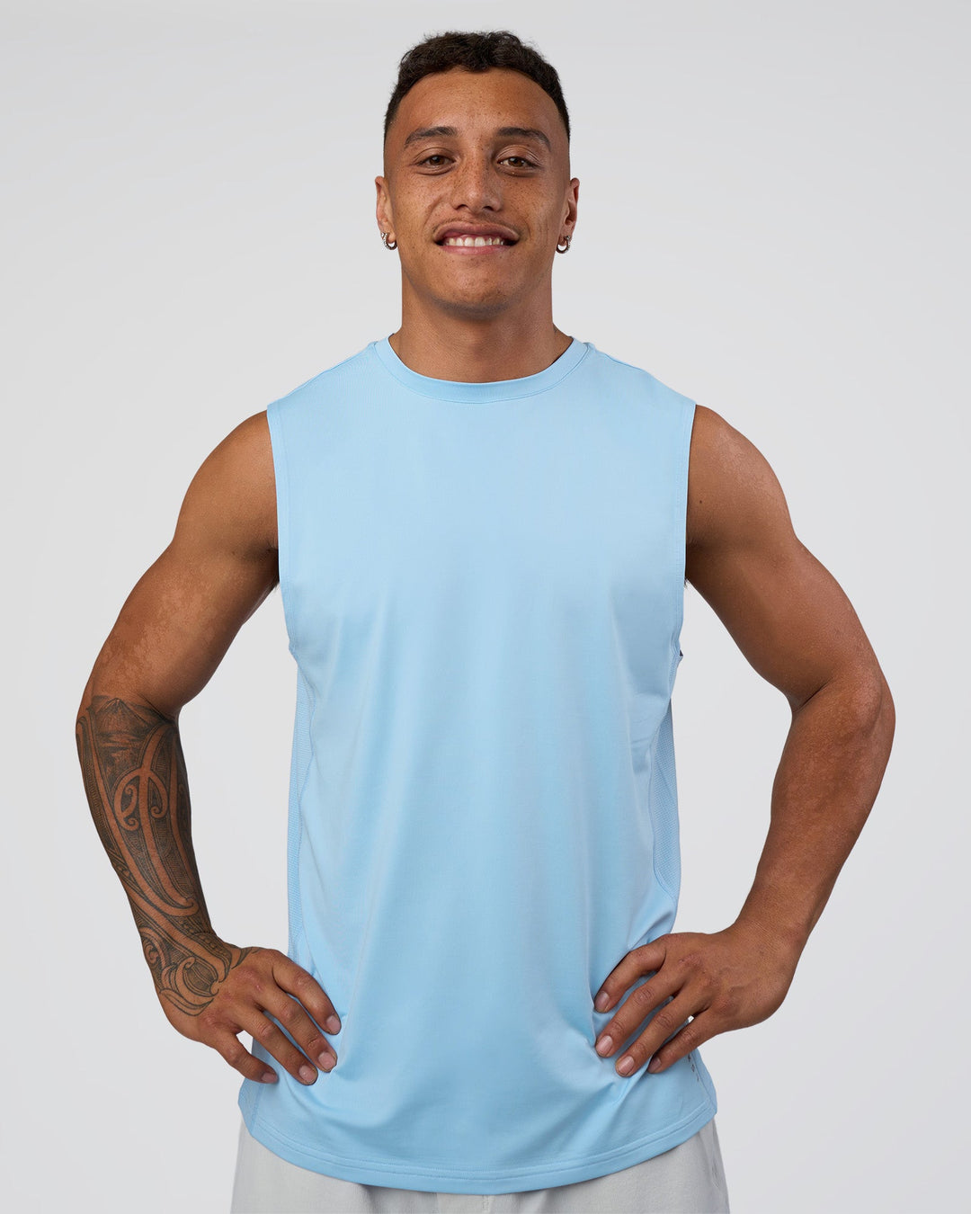 Man wearing AirTrack Muscle Tank - Open Air | Model:Daarian | Size:M