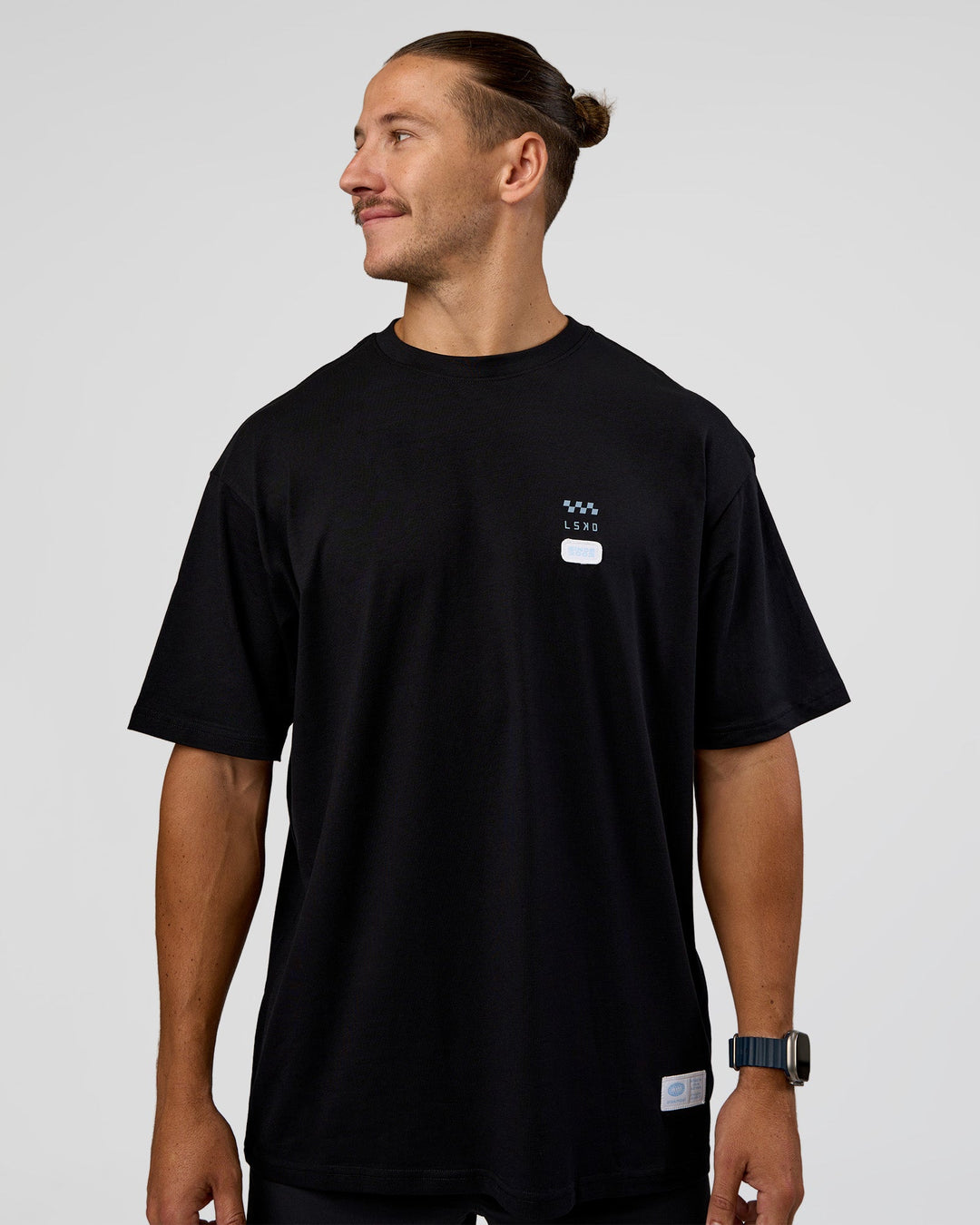 Man wearing Archive FLXCotton Oversized Tee - Black-Open Air | Model:Jaiden | Size:M