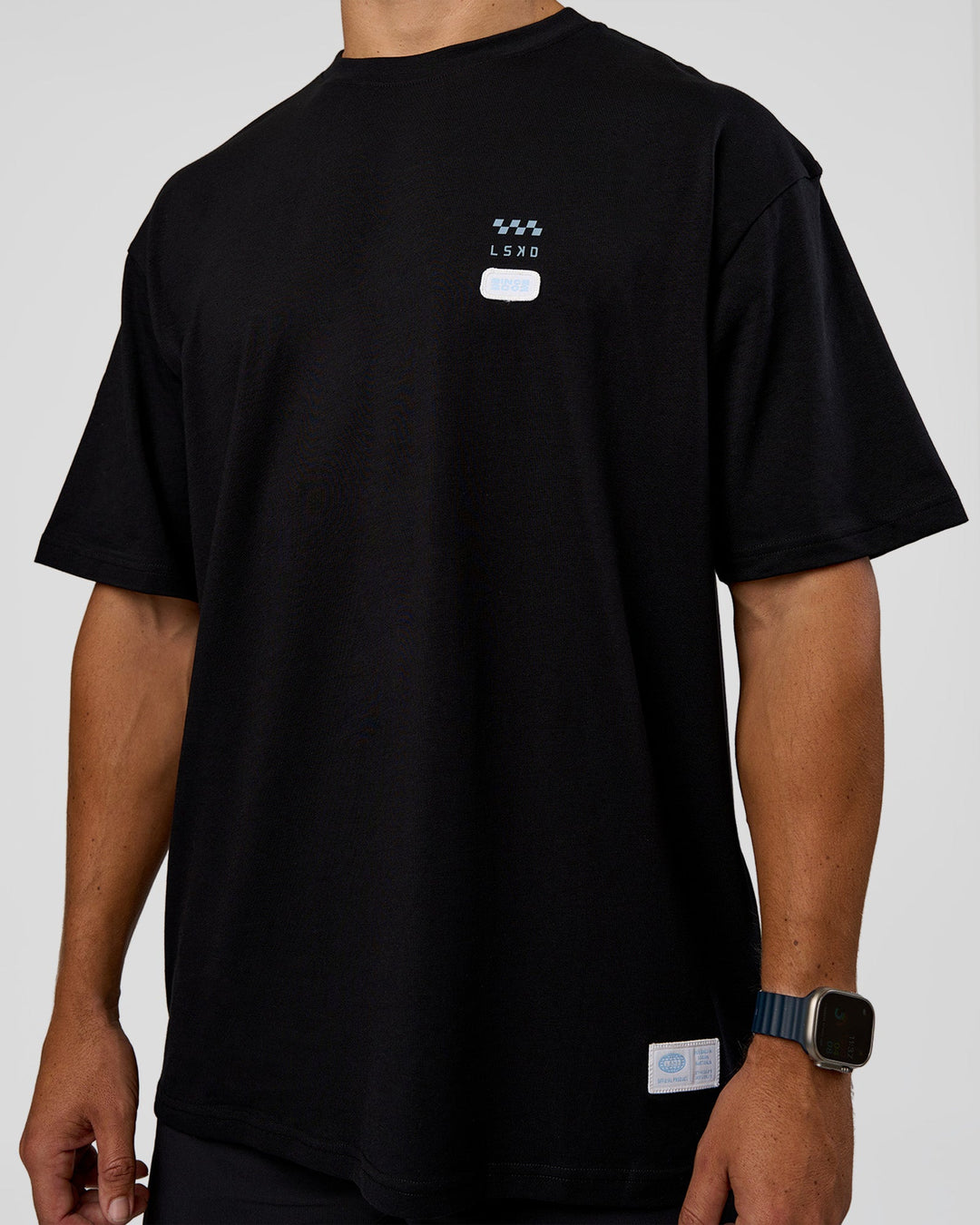 Man wearing Archive FLXCotton Oversized Tee - Black-Open Air | Model:Jaiden | Size:M