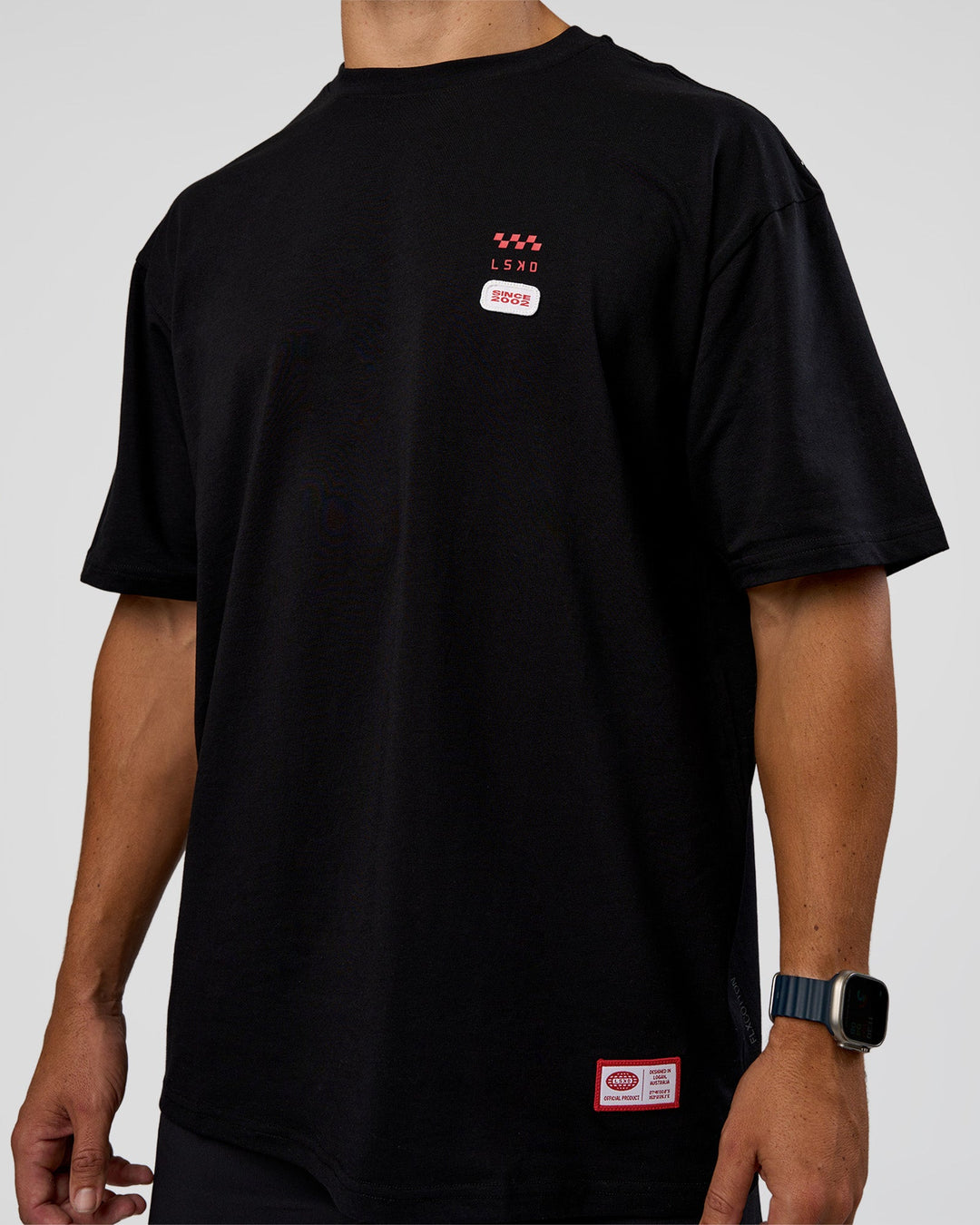 Man wearing Archive FLXCotton Oversized Tee - Black-Scarlet | Model:Jaiden | Size:M