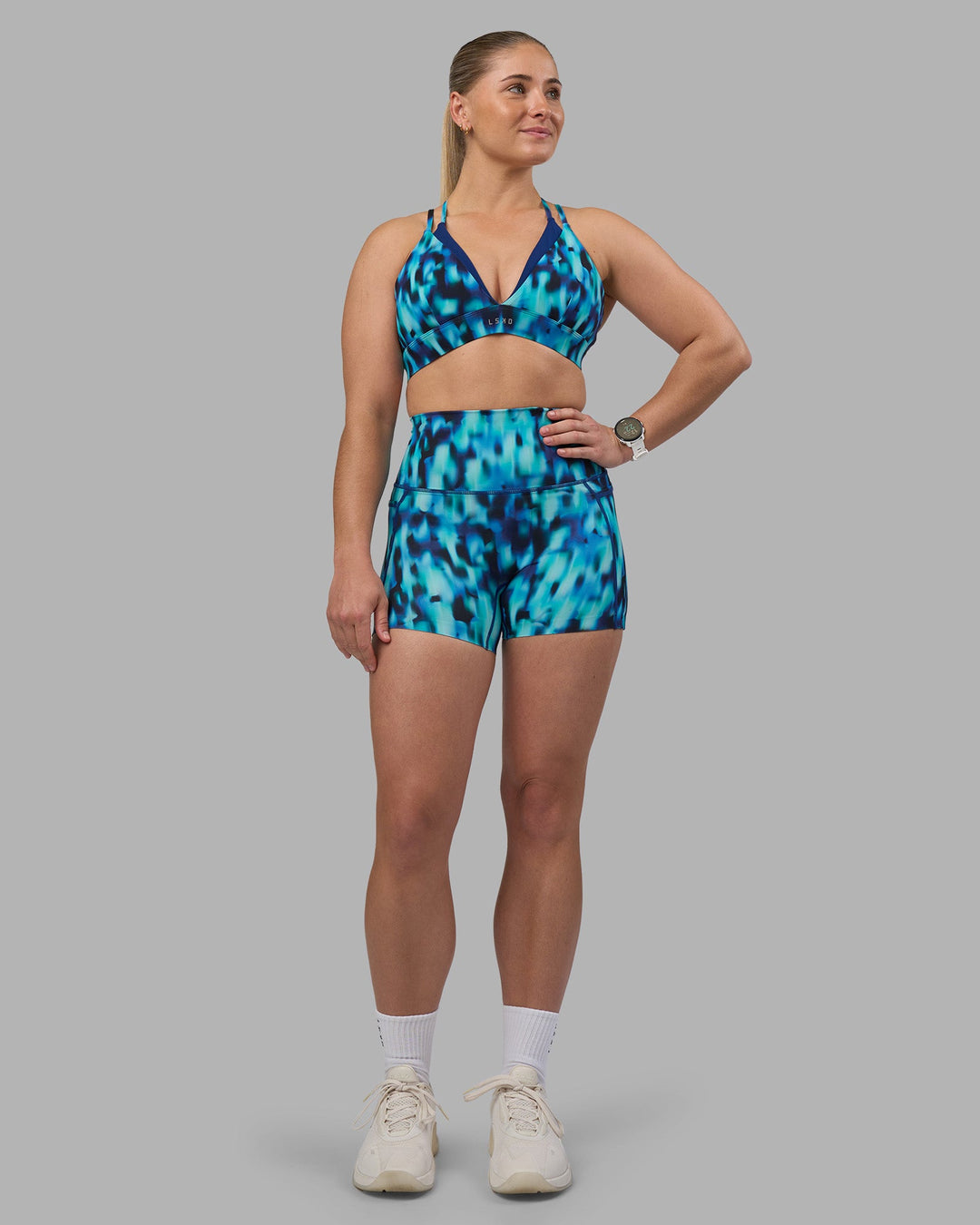 Woman wearing Aria Triangle Sports Bra - Luminous | Model:Sami | Size:M