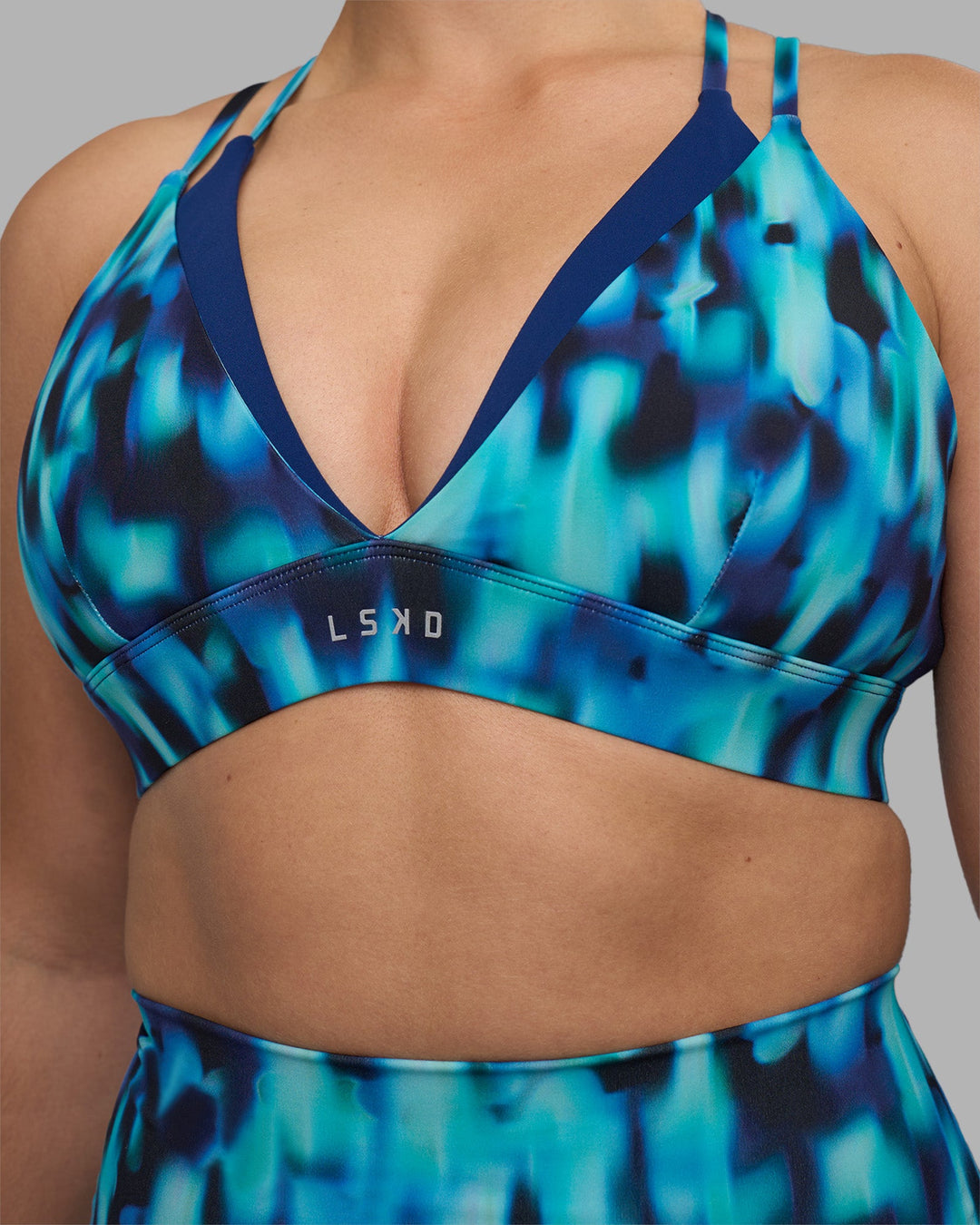 Woman wearing Aria Triangle Sports Bra - Luminous | Model:Sami | Size:M