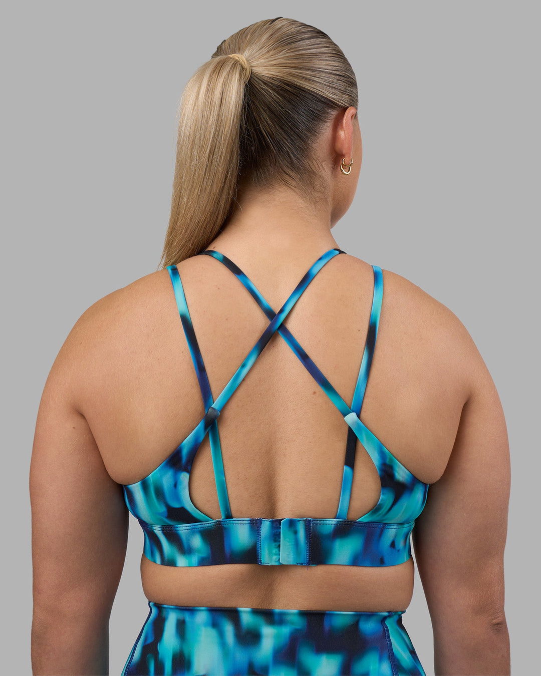Woman wearing Aria Triangle Sports Bra - Luminous | Model:Sami | Size:M
