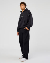 Man wearing Axis Oversized Hoodie - Caviar-White | Model:Leandro | Size:M