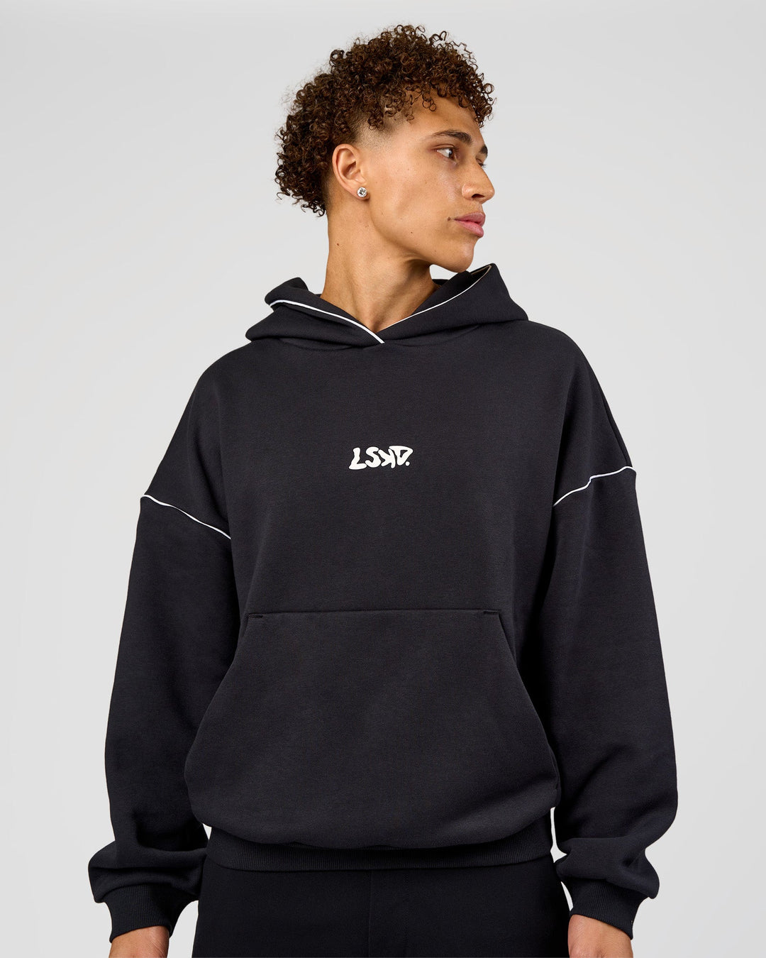 Man wearing Axis Oversized Hoodie - Caviar-White | Model:Leandro | Size:M