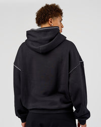 Man wearing Axis Oversized Hoodie - Caviar-White | Model:Leandro | Size:M