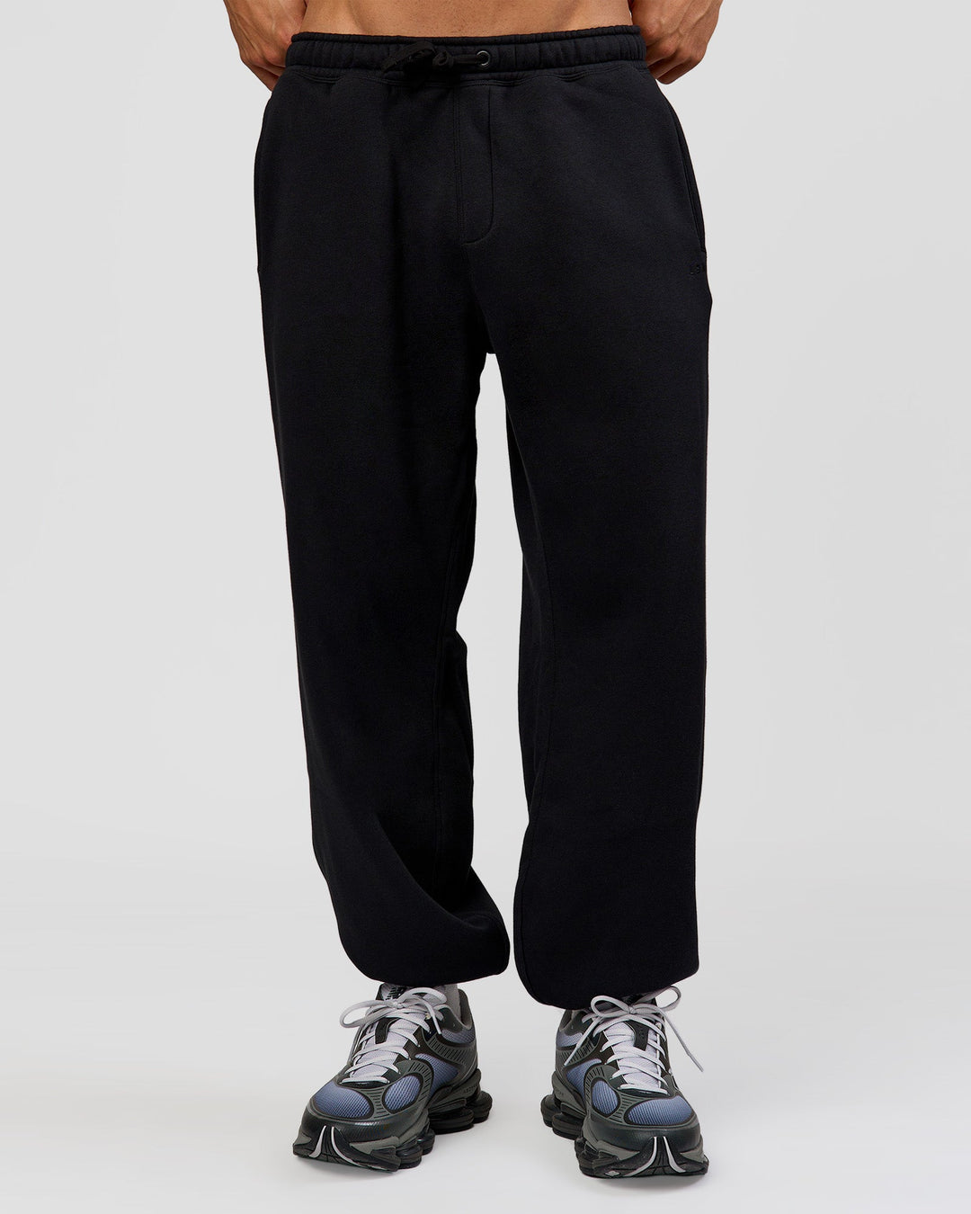 Man wearing Base Baggy Cuffed Track Pant - Black | Model:Albert | Size:M |
 - view 1