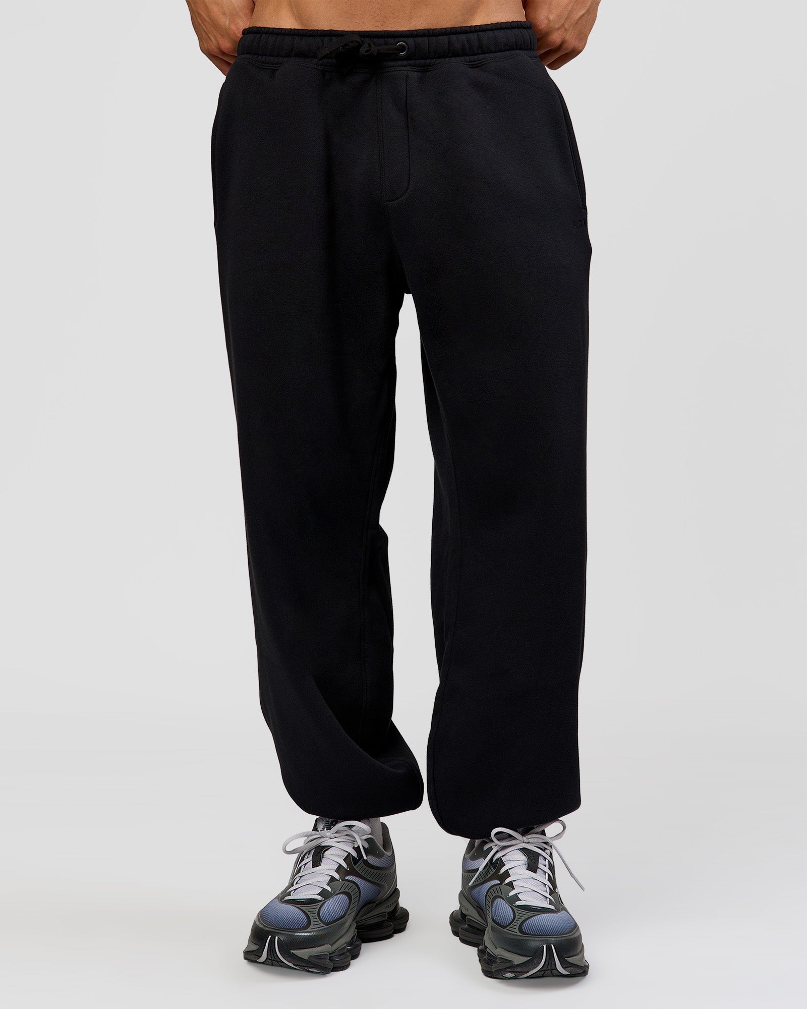 Man wearing Base Baggy Cuffed Track Pant - Black | Model:Albert | Size:M |
