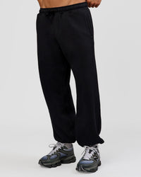 Man wearing Base Baggy Cuffed Track Pant - Black | Model:Albert | Size:M | | Thumbnail Index: 3