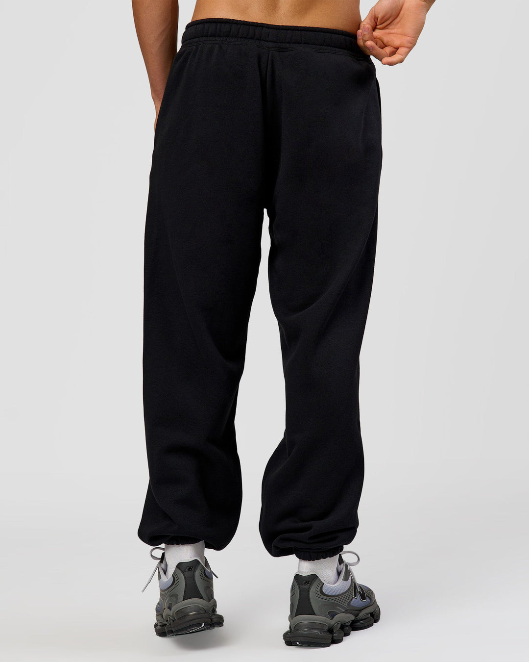Man wearing Base Baggy Cuffed Track Pant - Black | Model:Albert | Size:M | - view 3
