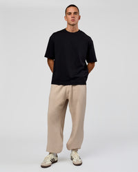 Man wearing Base Baggy Cuffed Track Pant - Shale Beige | Model:Albert | Size:M | | Thumbnail Index: 5