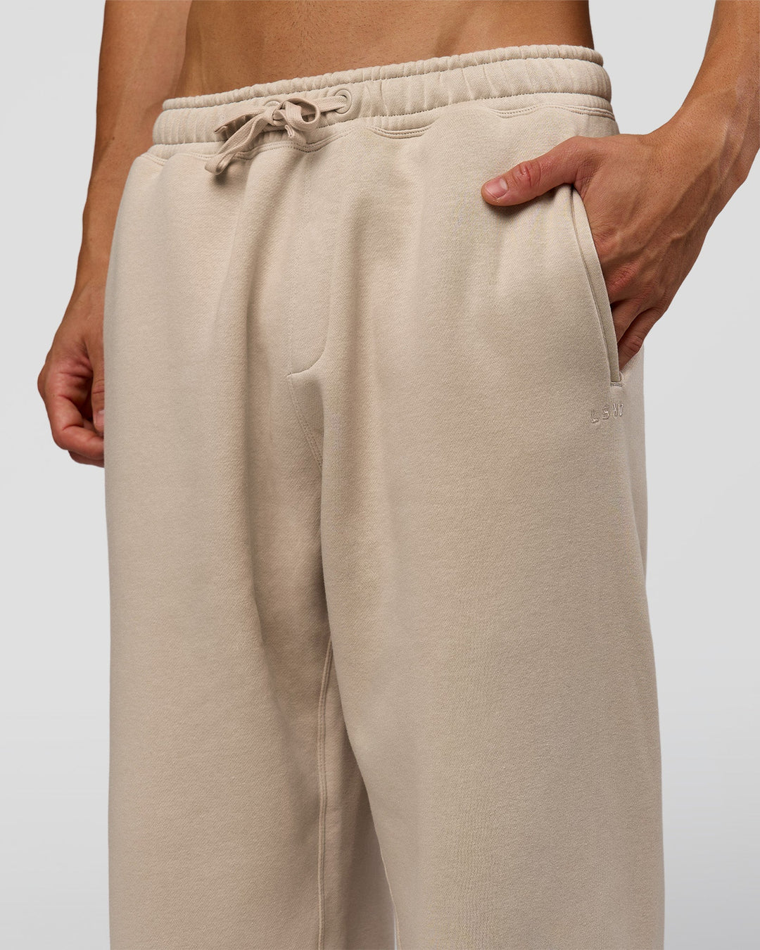 Man wearing Base Baggy Cuffed Track Pant - Shale Beige | Model:Albert | Size:M | - view 4