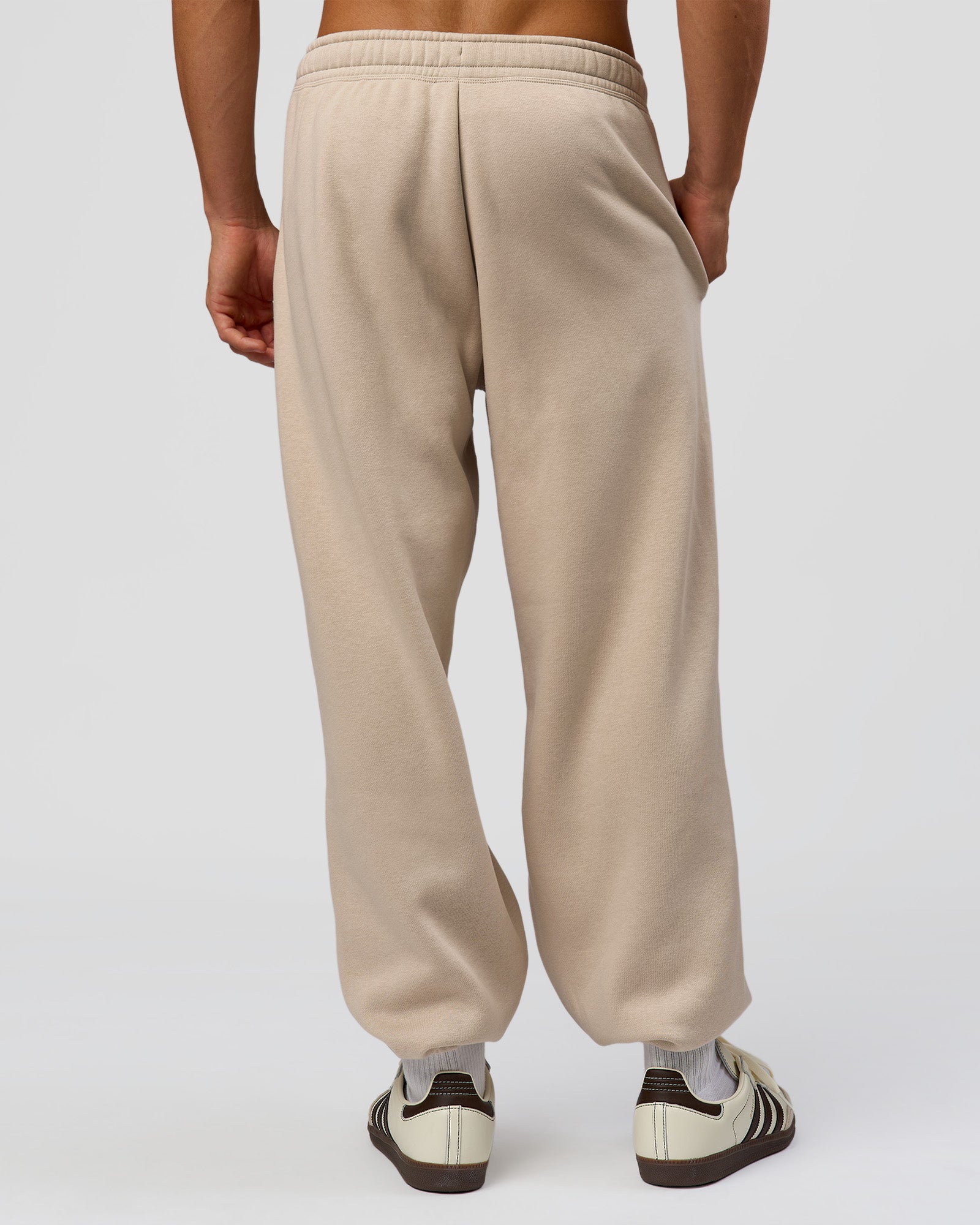 Man wearing Base Baggy Cuffed Track Pant - Shale Beige | Model:Albert | Size:M |
