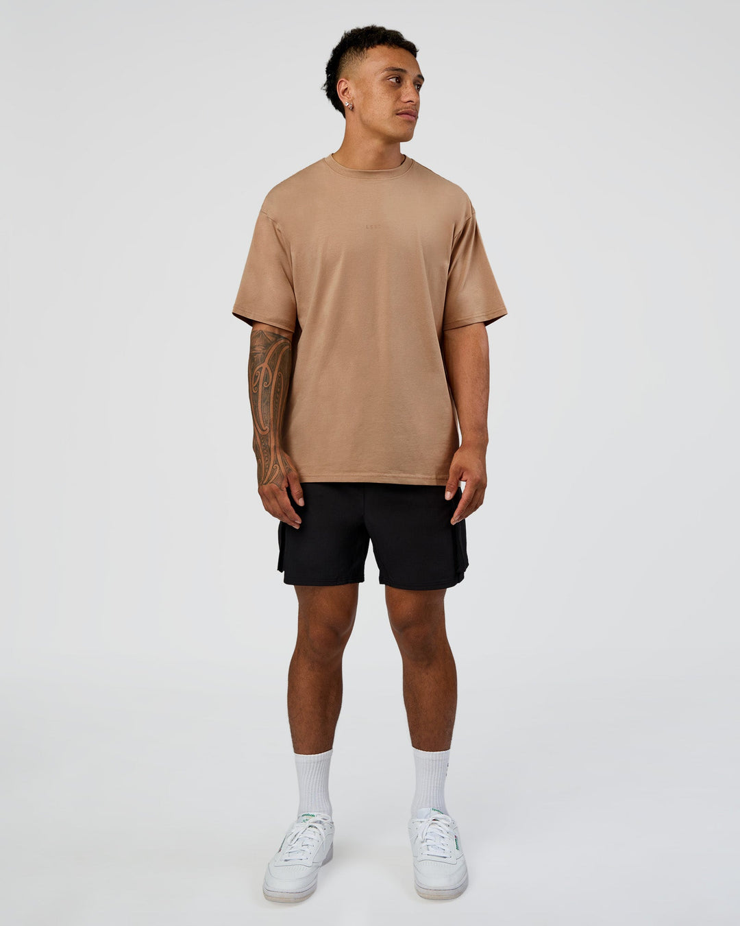 Man wearing Base FLXCotton Tee Oversized - Warm Smoke | Model:Daarian | Size:M - view 2
