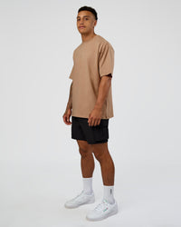 Man wearing Base FLXCotton Tee Oversized - Warm Smoke | Model:Daarian | Size:M | Thumbnail Index: 4