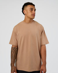 Man wearing Base FLXCotton Tee Oversized - Warm Smoke | Model:Daarian | Size:M | Thumbnail Index: 0