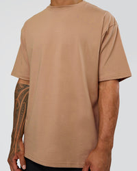 Man wearing Base FLXCotton Tee Oversized - Warm Smoke | Model:Daarian | Size:M | Thumbnail Index: 3