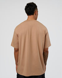 Man wearing Base FLXCotton Tee Oversized - Warm Smoke | Model:Daarian | Size:M | Thumbnail Index: 2