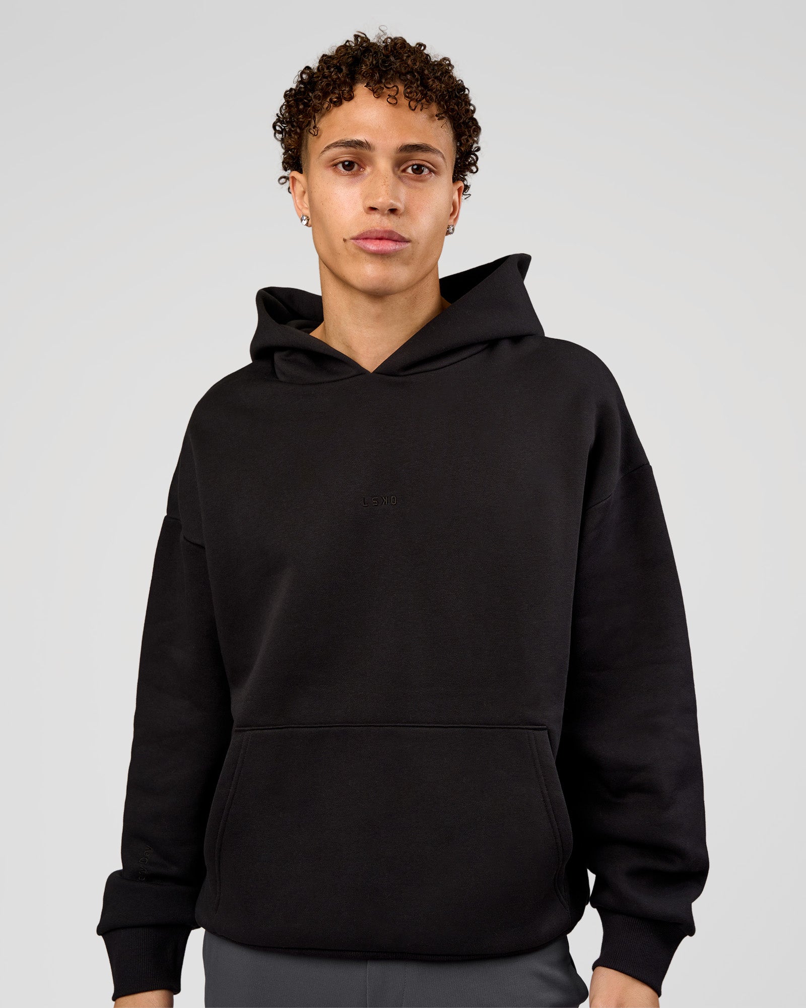 Man wearing Base Oversized Hoodie - Black | Model:Leandro | Size:M |