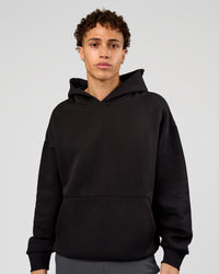 Man wearing Base Oversized Hoodie - Black | Model:Leandro | Size:M | | Thumbnail Index: 0