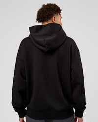 Man wearing Base Oversized Hoodie - Black | Model:Leandro | Size:M | | Thumbnail Index: 1