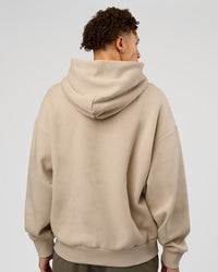 Man wearing Base Oversized Hoodie - Shale Beige | Model:Leandro | Size:M | | Thumbnail Index: 1