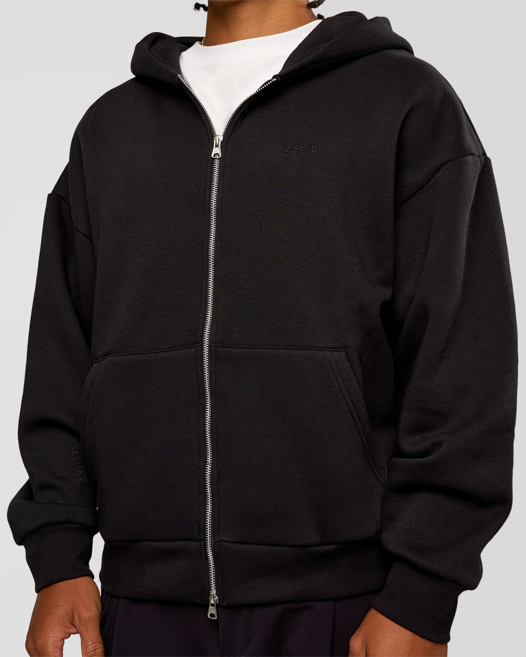 Man wearing Base Zip Through Oversized Hoodie - Black | Model:Malebo | Size:M